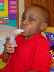 image of boy with nebulizer